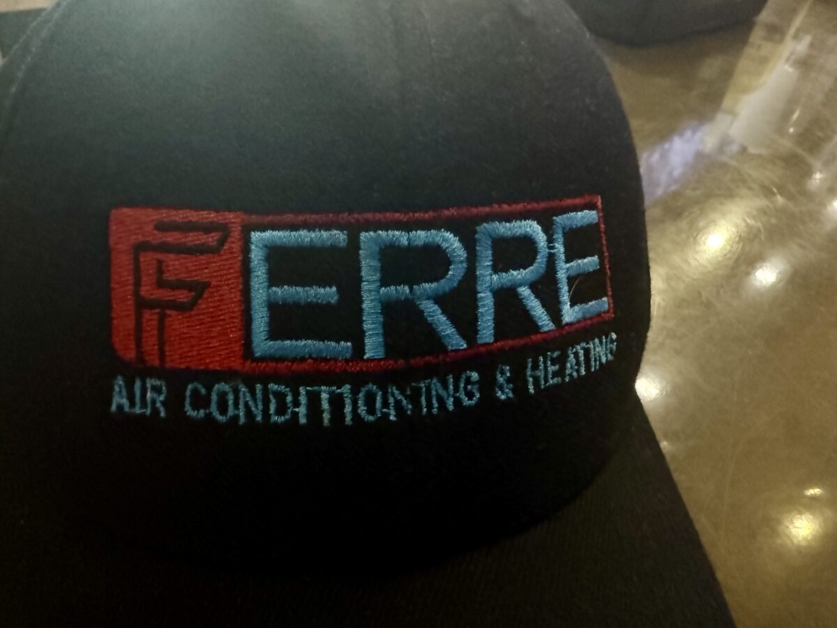 A cap embroidered with the Ferre Air Conditioning and Heating logo