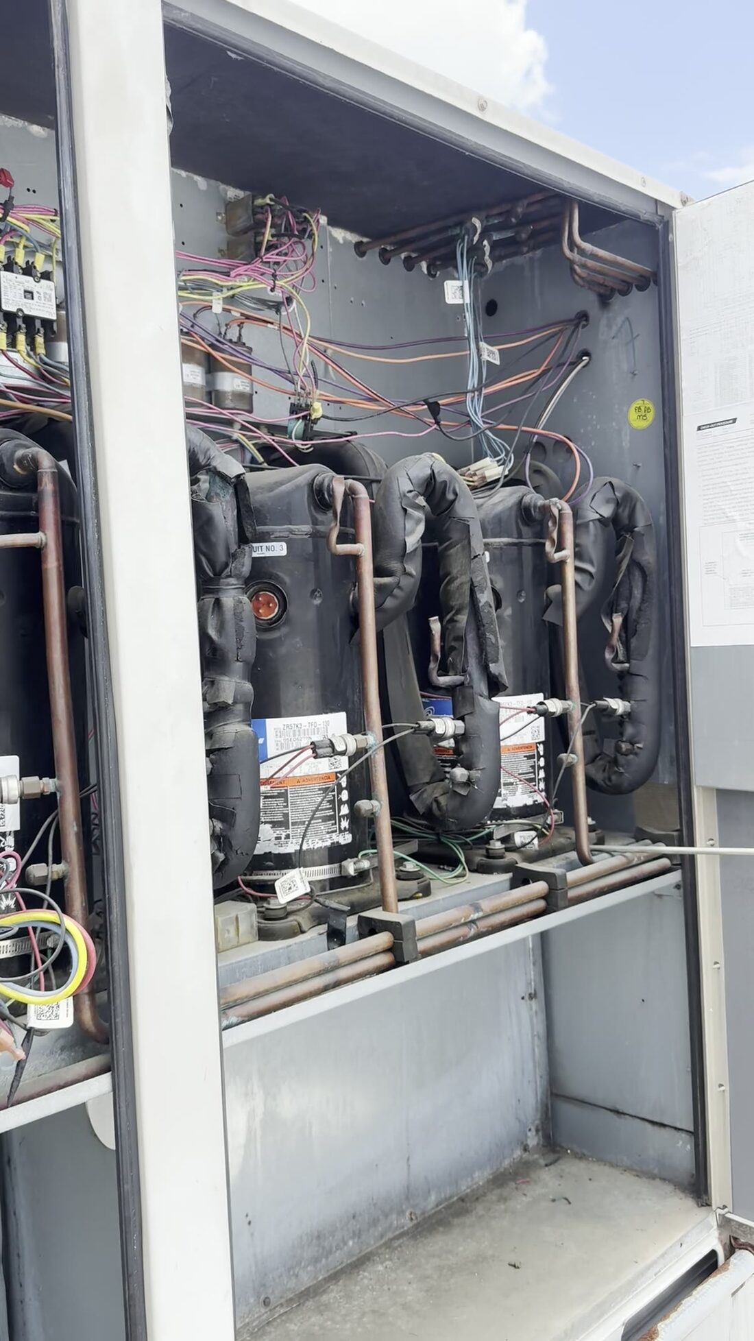 Compressors, copper and capacitors in a row where you can read them.