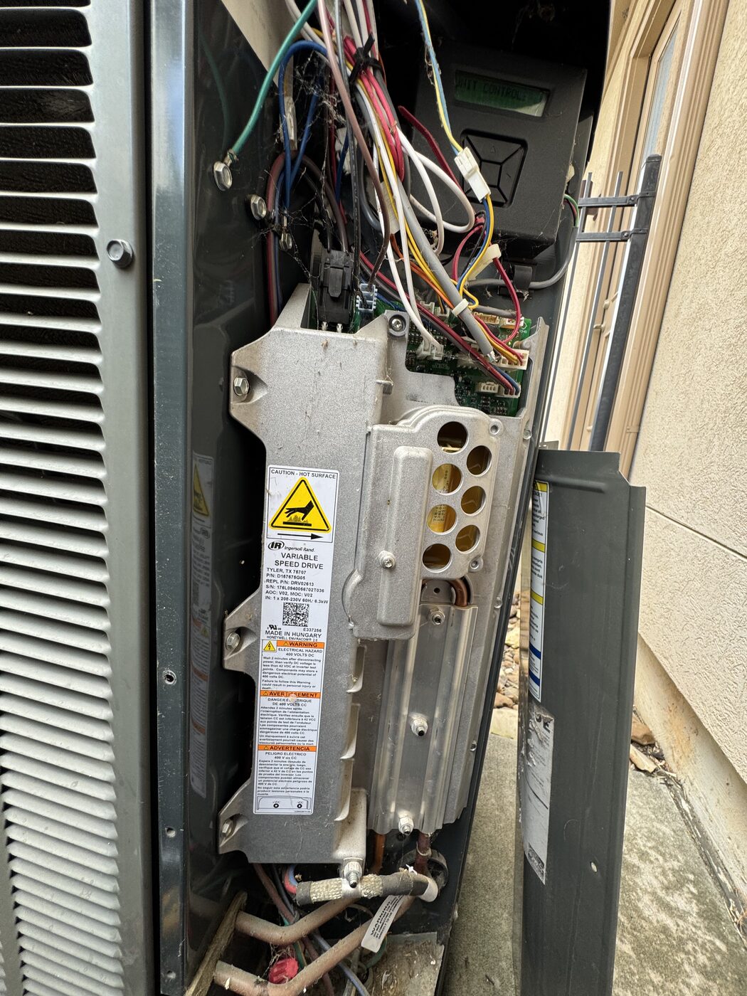 Electrical whip and disconnect wiring at an outdoor unit